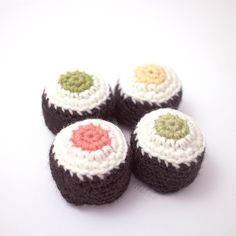 four crocheted donuts sitting on top of each other