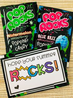 three pop rocks candy bars are sitting next to a sign that says, hope your summer rocks