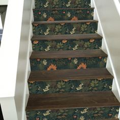 the stairs are decorated with flowers and leaves