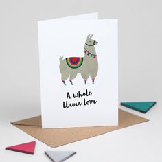 a card with an image of a llama wearing a rainbow scarf and text that reads, a whole llama love