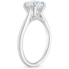 a white gold engagement ring with an oval cut diamond