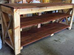 a table made out of wooden planks in a garage