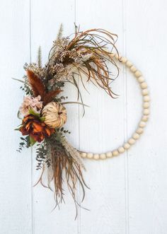 Fall Boho Bead Wreath with Rattan Pumpkin, Rust Peony and Pampas grass door decor Boho Beaded Wreath, Pampas Grass Door Wreath, Christmas Pampas Wreath, Fall Wreath With Pampas, Boho Fall Outdoor Decor, Pampas Grass Fall Wreath, Boho Bead Wreath, Cheap Diy Fall Wreath, Eucalyptus Fall Decor