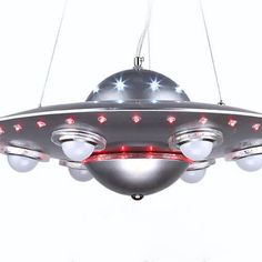 a large metal object with lights hanging from it's sides