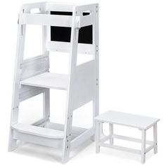 a white wooden dollhouse furniture set with a black and white chair, desk and step ladder