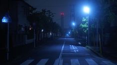 an empty street at night with no cars on it