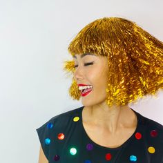 This tinsel wig is a classic bob style and is as sexy as they come! Higher quality than those shiny "wig-in-a-bag" offerings you might find in a costume or party store; the wig cap is the same quality as our fashion wigs. Ready for your New Year's Eve / Futuristic / Disco, and oh, so much more! Please note that the Crystal in iridescent is a slightly different style; it's the same length, but at the ends it has a bit of a flip! It's absolutely darling, but doesn't hang the same way as all the other colors in this style. We will include a wig cap with your purchase. Care instructions, as well as wearing tips, are included with your wig. Made from synthetic fibers. Not safe to use heat when styling.All sales are final. Futuristic Disco, Tinsel Wig, Sparkle Gift, Diy Wig, Classic Bob, Wig Party, Fashion Wigs, Party Store, Sparkle Jewelry