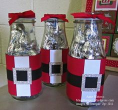 three jars with candy in them sitting on a table