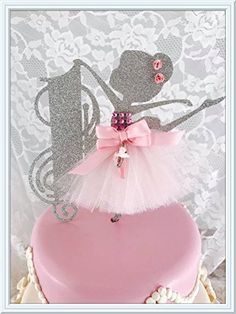 there is a cake that has been decorated like a ballerina