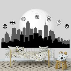 the batman skyline wall decal is shown in black and white