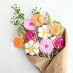 a bouquet of flowers is wrapped in plastic