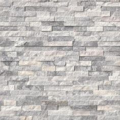 an image of a stone wall that looks like it is made out of grey and white bricks