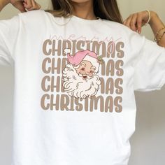 The Preppy Christmas T-Shirt features a festive design with Santa Claus and Merry Christmas elements, perfect for the holiday season. This Aesthetic Christmas T-Shirt is stylish and comfortable, making it a great choice for spreading holiday cheer. Whether you're attending a Christmas party or just want to add a festive touch to your wardrobe, this Christmas shirt is a fun and fashionable option. You are going to slay Christmas with this T Shirt. Christmas Shirts Aesthetic, Christmas T Shirt Ideas, Preppy Christmas, Cute Christmas Shirts, Christmas Elements, Shirt Aesthetic, Merry Christmas Shirts, Aesthetic Christmas, Festive Design