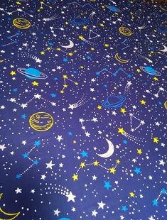 an image of a bed with stars and planets on it