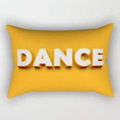 a yellow pillow with the word dance printed on it