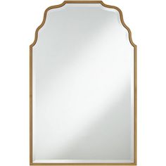 a large mirror with an arched frame and gold trimmings on the bottom half