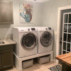 a washer and dryer in a small room