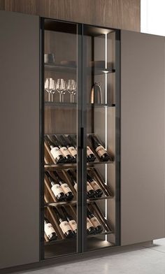 a wine rack with many bottles and glasses in it