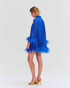 The Pleated Feather Trim Mini Dress was part of the Spring 2023 Runway Collection. This A-line dress features hand-dyed genuine Ostrich feather trimmed sleeves and hem, and a back button closure. Incorporating pleats, this mini dress is fully lined. Made in Brazil. VEC24295US Spring 2023 Runway, Ostrich Feather Trim, Feather Trim, Ostrich Feather, Ostrich Feathers, Spring 2023, Runway Collection, Made In Brazil, Hand Dyeing