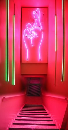 a neon sign in the corner of a room