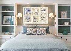 a bedroom with blue and white decor on the wall above the bed, along with built - in bookshelves