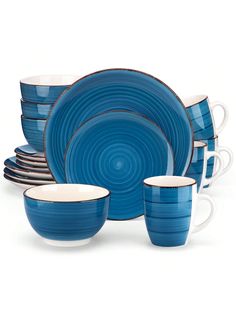 a blue and white dinner set with matching cups