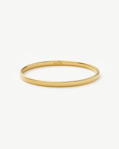 Classic Round Bangle | 18k Gold Plated. Keep It Classic with a Simple Bangle Bracelet – an Everyday Jewellery Wardrobe Essential. Designed to Slide on Easily, Wear Solo or Pair with Chunky Chains to Create a Bold Arm Stack. Metal: 18K Recycled Gold Plating on Brass Small Band Width: 4. 6mm Band Thickness: 2. 2mm Inner Diameter: 60mm Weight: 17. 5g Medium Band Width: 4. 6mm Band Thickness: 2. 2mm Inner Diameter: 64mm Weight: 17. 5g Large Band Width: 4. 6mm Band Thickness: 2. 2mm Inner Diameter: 68mm Weight: 17. 5g Product Code: Yn-G-B7-Ns Arm Stack, Jewellery Wardrobe, Classic Bangles, Small Band, Diamond Ear Cuff, Everyday Jewellery, Trending Bracelets, Simple Bangle, Jewelry Hair Accessories