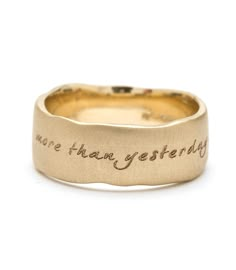 a gold ring with the words, we are there yet today written on it in cursive writing