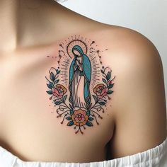 a woman with a tattoo on her shoulder that has an image of the virgin mary