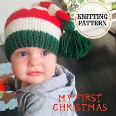 a baby wearing a knitted christmas hat