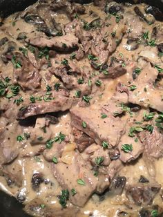 meat and mushroom stew with gravy in a slow cooker, ready to be eaten