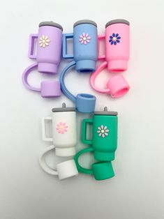 a group of different colored cups sitting next to each other