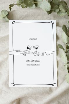 a wedding card with two hands holding wine glasses