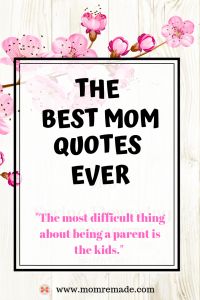 the best mom quotes ever with pink flowers on white wooden planks and black frame