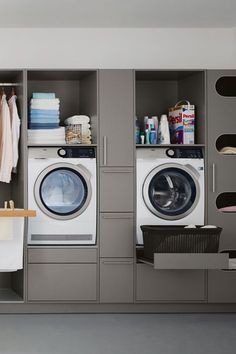 a washer and dryer sitting in a room next to each other on shelves