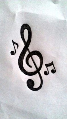 a drawing of a musical note with music notes in the middle, on white paper