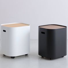 two black and white stools sitting next to each other