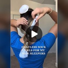 a woman in blue shirt brushing her hair with scissors and text that reads heatless sock curls for my side sleepers