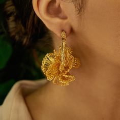 These fun ruffled, hand-crocheted hoops were fabricated by highly skilled Brazilian artisans. They feature shiny gold wire is supplemental to the fine craft artwork spent in every piece of our jewelry. They feature 18 karat gold filled copper wire and create a statement look without the weight or bulk! These are very comfortable to wear and perfect for every occasion, from day to day use or even a more special celebration! Made from non-allergenic (hypoallergenic) and nickel-free. Stunning jewelry that will last for a lifetime. Each pair of earrings takes hours to finish. The result is a remarkable piece of jewelry. This piece is 100% Hand Crocheted made with 18k Gold filled wire in Brazil. This is an authentic piece of Lavish Jewelry by Tricia Milaneze and it was handcrafted with noble an Felt Pouch, Color Complement, Hypoallergenic Jewelry, Leather Conditioner, Gold Threads, Stunning Earrings, Gold Wire, Gold Floral, Stunning Jewellery