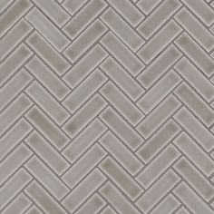 an image of a tile pattern that looks like herringbones