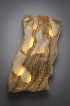 a piece of wood with some lights on it