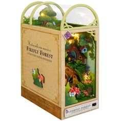 a wooden box with a fairy forest scene inside