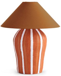 an orange and white striped ceramic lamp with a brown shade on the top of it