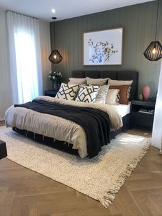 a large bed sitting on top of a wooden floor