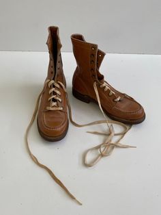 Vintage 1970s Bearfoot Work Boots Leather Free Shipping These boots are cool! They are small, I believe they are a men's or youth 4, which would make them a woman's size 6. I wear a women's 8, and I could pull them on, but barely, way too small. The markings on the inside are on suede which makes it hard to read. They are in good vintage condition with no major flaws. They have a Moc toe and are very sturdy. The heel was reinforced with a BF Goodrich heel. The color is sort of a rusty or gold colored brown. Inside sole measures 9.5" outside, toe to heel 10 1/8" mens/youth size 4  women's size 6 Shoes Boots Combat, Boots Leather, Mens Shoes Boots, Vintage 1970s, Work Boots, Leather Boots, Combat Boots, Monument, Gold Color