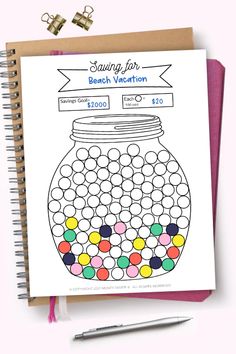 a coloring book with an image of a jar full of balls on it and a pen next to it