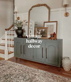 an antique hallway decor is displayed in front of a mirror