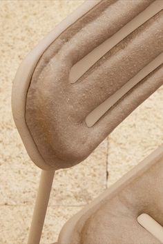 an up close view of a chair that is made out of concrete