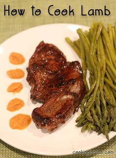 a white plate topped with meat and green beans