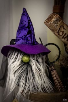 a close up of a stuffed animal wearing a witches hat